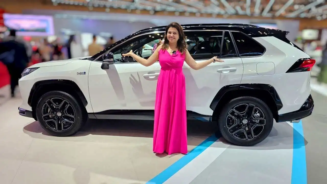 Image of a woman showcasing the new 2025 Toyota Hyryder Hybrid